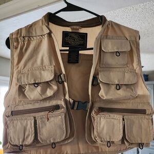 White River Fishing Vest With Mulyiple Pockets, Zippers, And A Fold Out Fly Hold